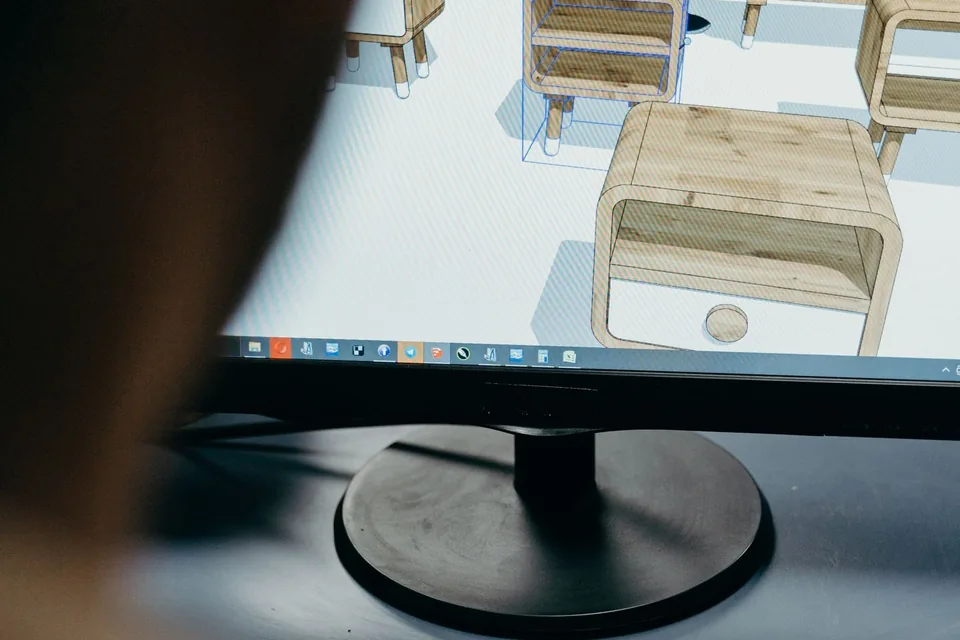 Computer monitor displaying a three-dimensional furniture model